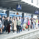 People arrive on a train platform at Hauptbahnhof railway station during the Pentecost long weekend on June 4, 2022 in Munich, Germany. Germany, in an effort to dissuade people from traveling by car and to provide relief from the current high level of inflation, introduced a 9 Euro monthly railway ticket on June 1 that covers local and regional travel nationwide.